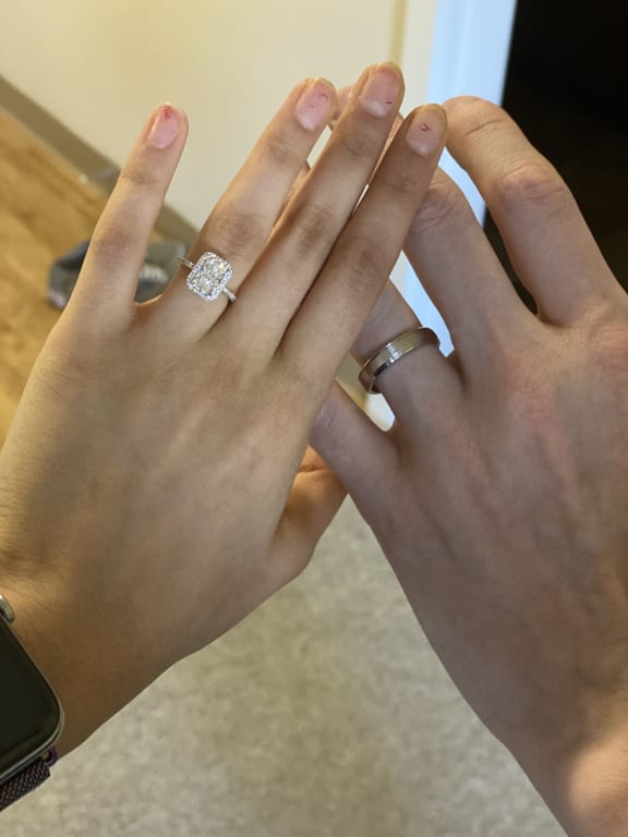 Oval diamond ring on hand