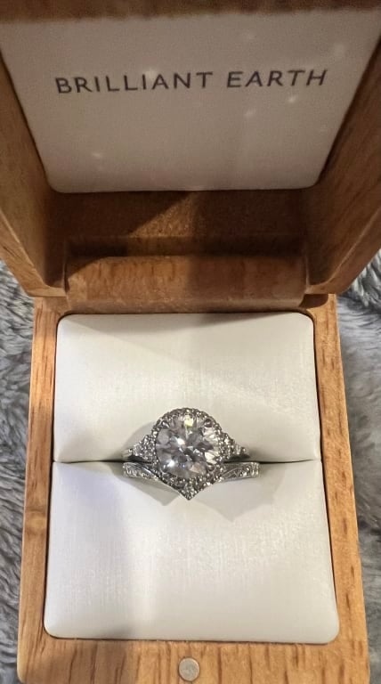 Oval diamond ring on hand
