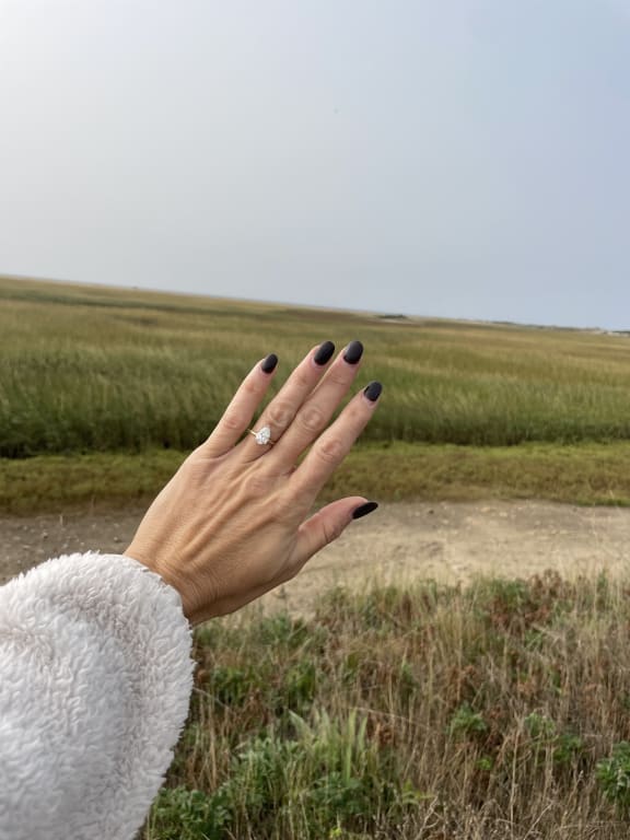 Oval diamond ring on hand
