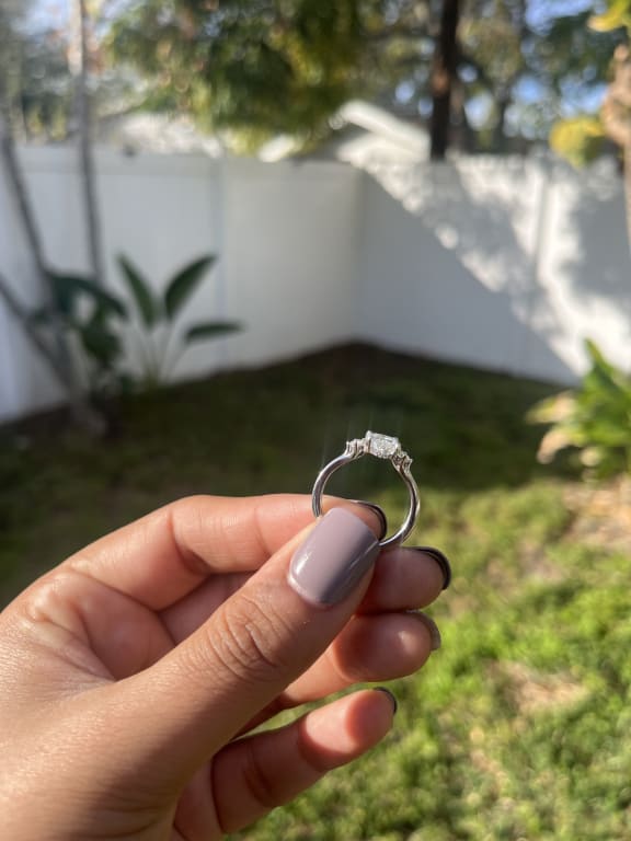 Oval diamond ring on hand
