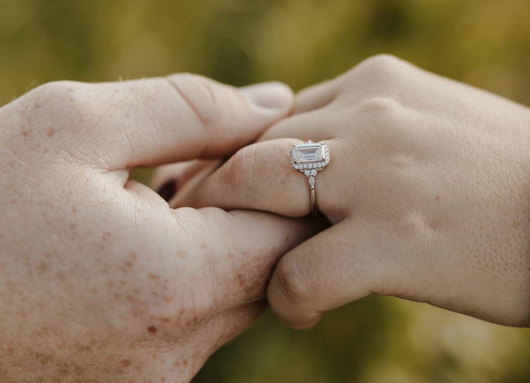 Oval diamond ring on hand