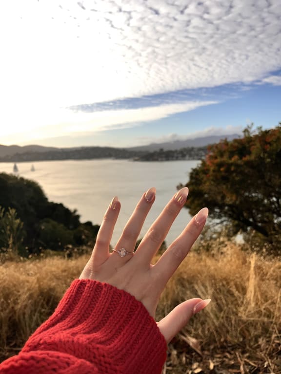 Oval diamond ring on hand