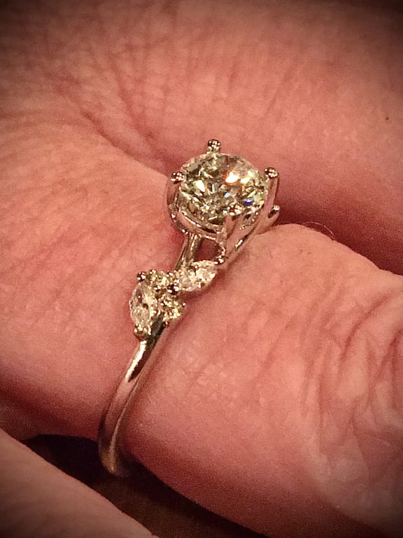 Oval diamond ring on hand