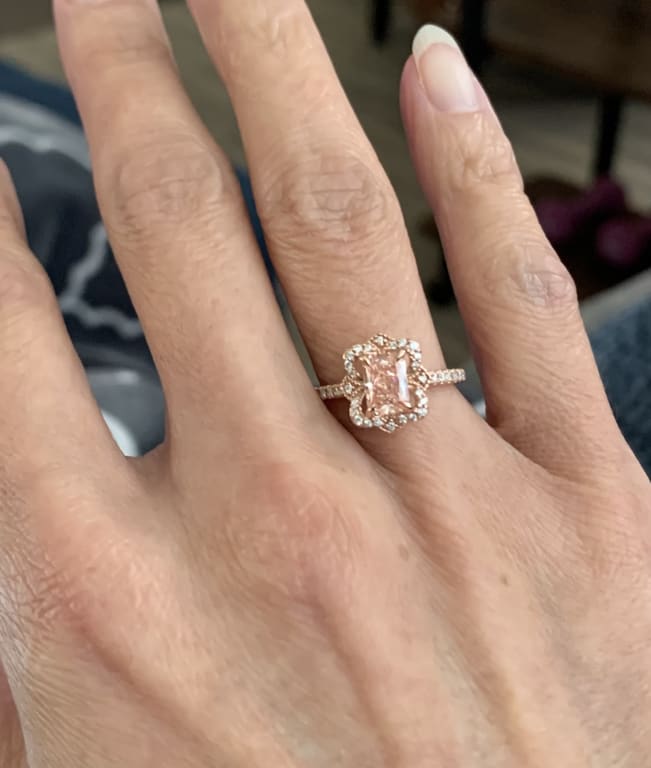 Oval diamond ring on hand