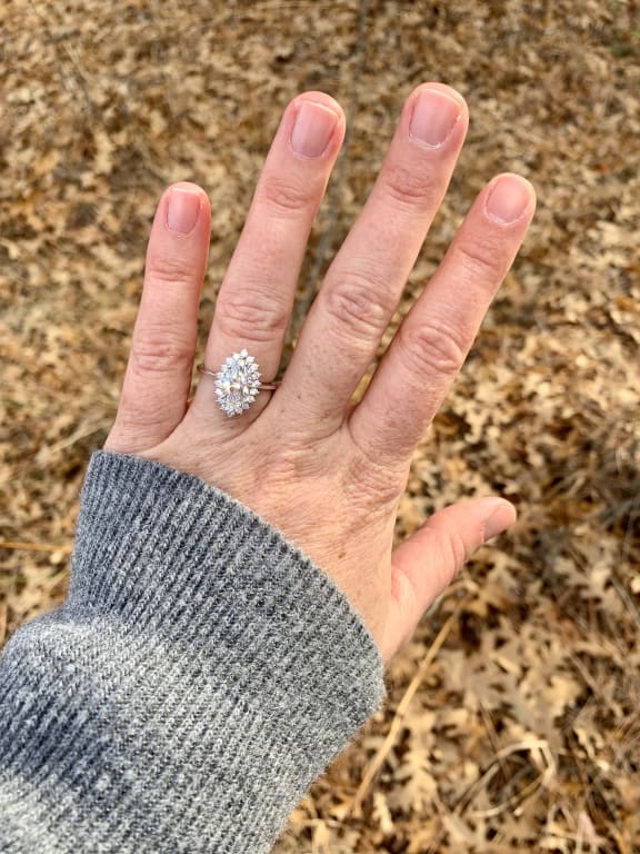 Oval diamond ring on hand