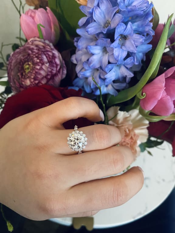 Oval diamond ring on hand
