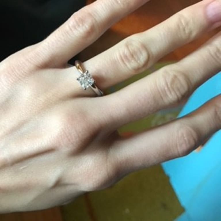 Oval diamond ring on hand