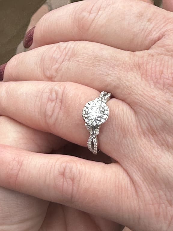 Oval diamond ring on hand