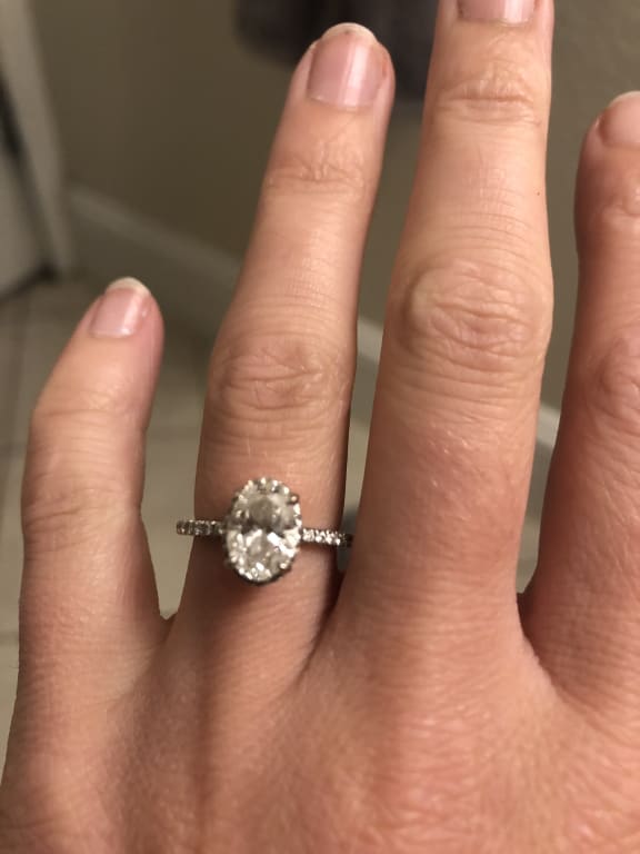 Oval diamond ring on hand