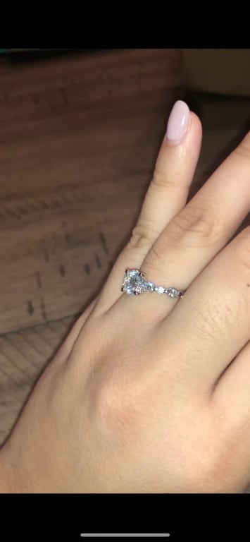 Oval diamond ring on hand