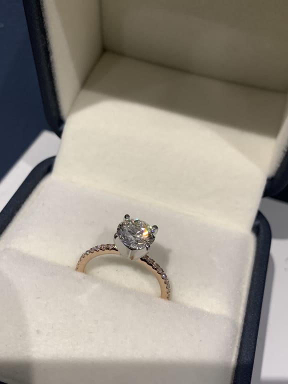 Oval diamond ring on hand