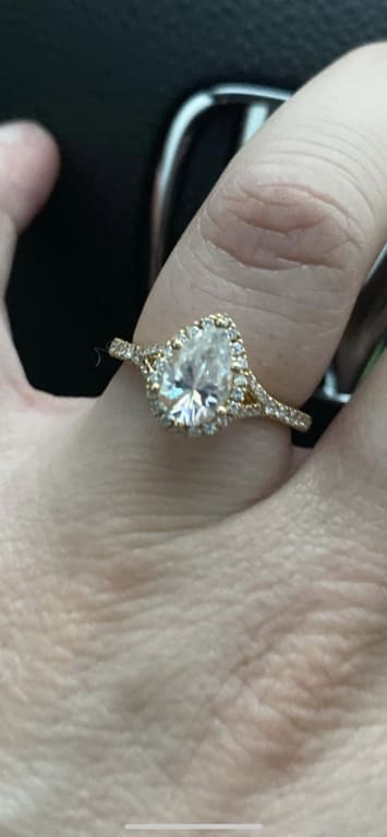 Oval diamond ring on hand