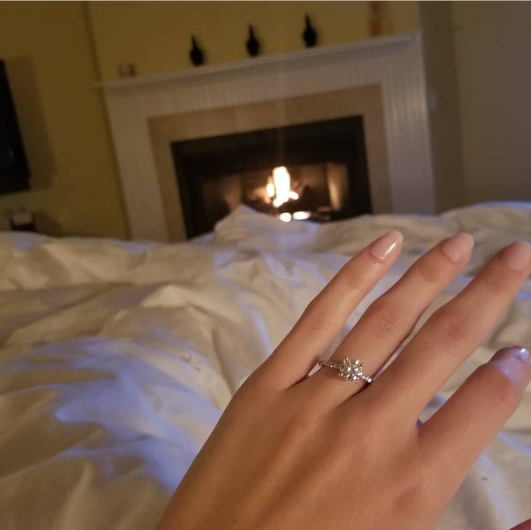 Oval diamond ring on hand