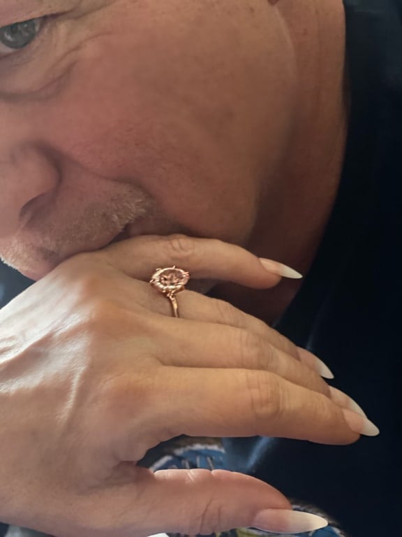 Oval diamond ring on hand