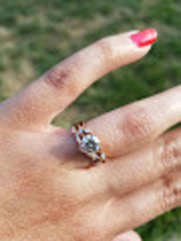 Oval diamond ring on hand
