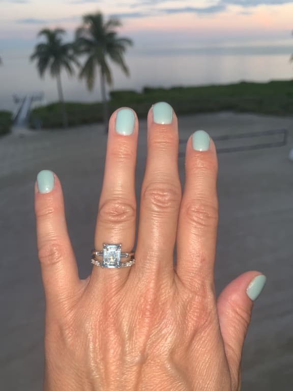 Oval diamond ring on hand