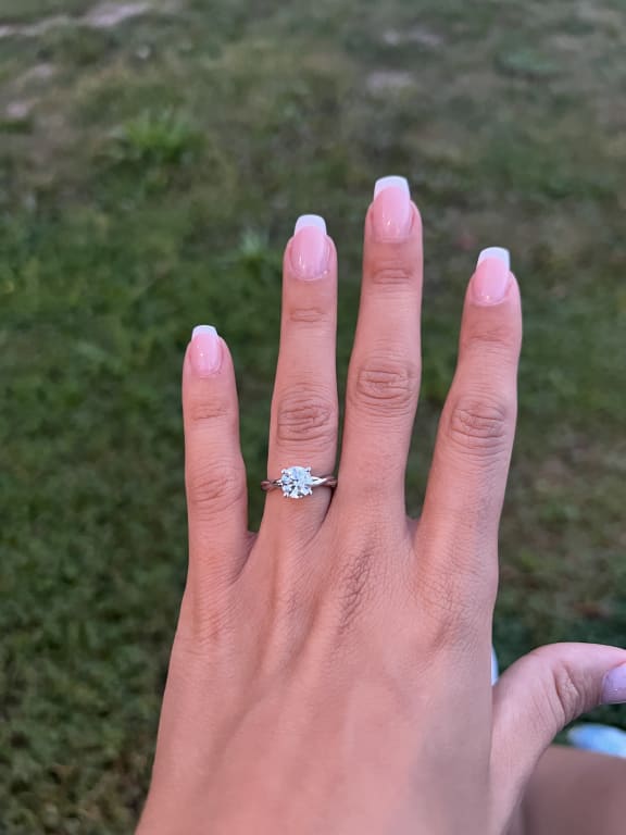 Oval diamond ring on hand
