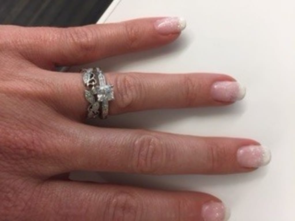 Oval diamond ring on hand