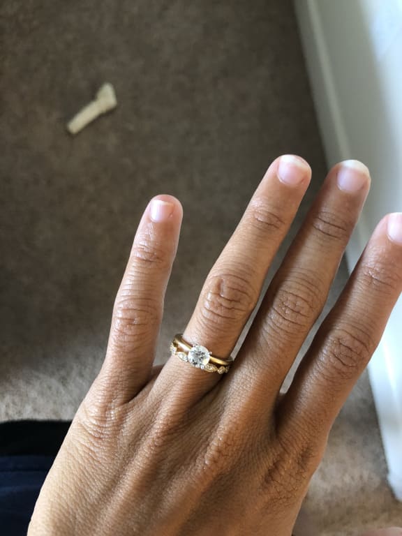 Oval diamond ring on hand