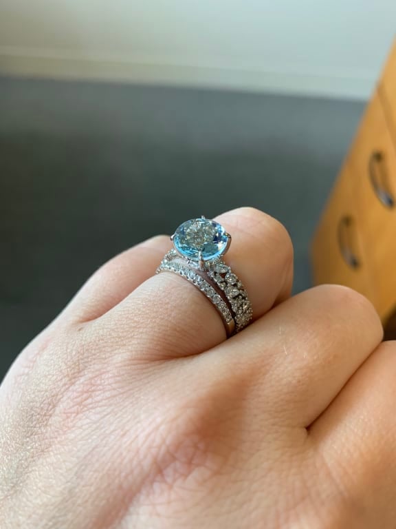 Oval diamond ring on hand