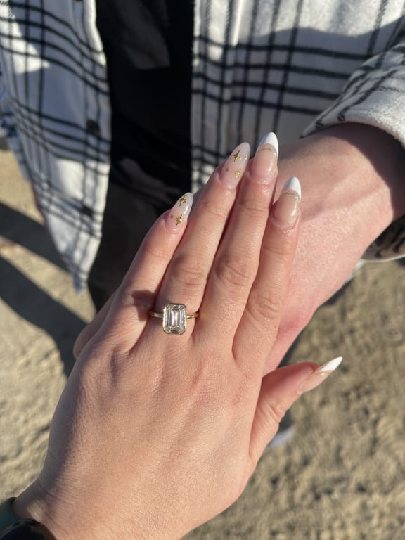 Oval diamond ring on hand