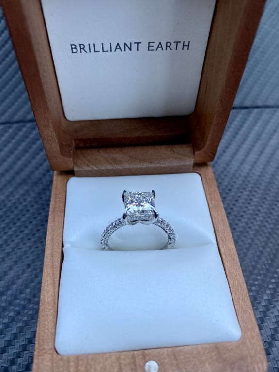 Oval diamond ring on hand