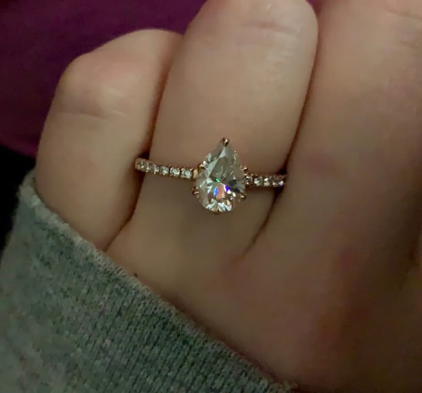 Oval diamond ring on hand