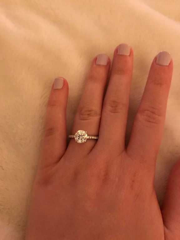 Oval diamond ring on hand