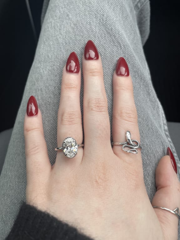 Oval diamond ring on hand