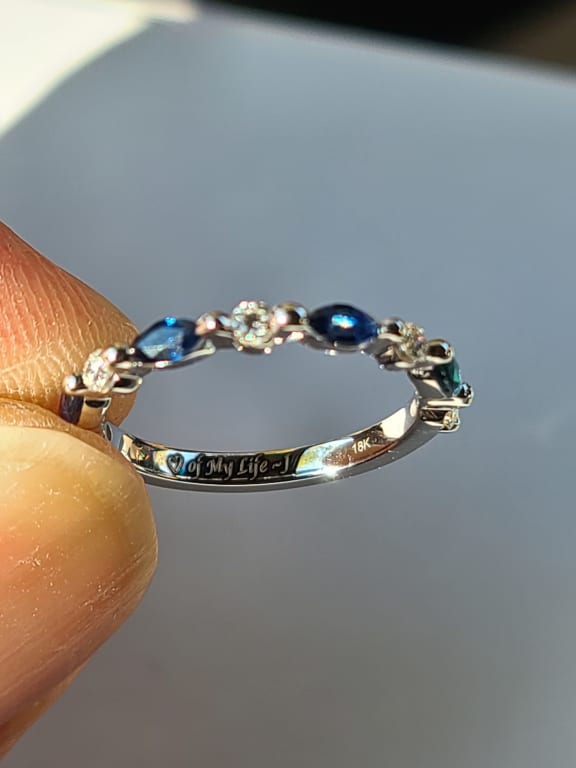 Oval diamond ring on hand