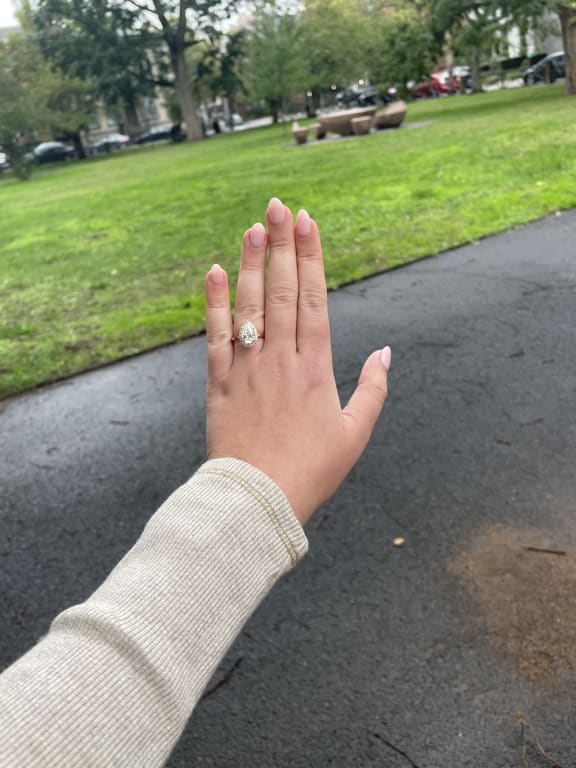 Oval diamond ring on hand