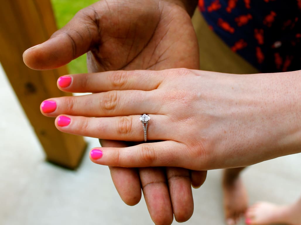 Oval diamond ring on hand