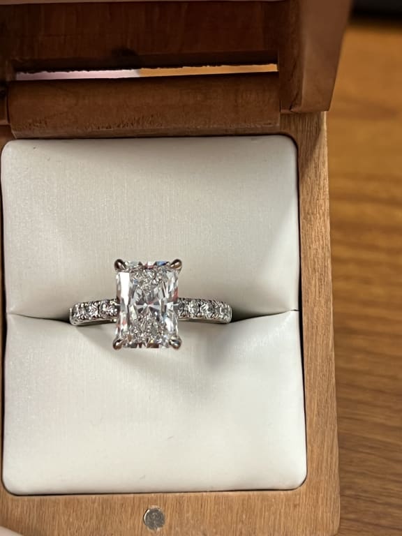 Oval diamond ring on hand