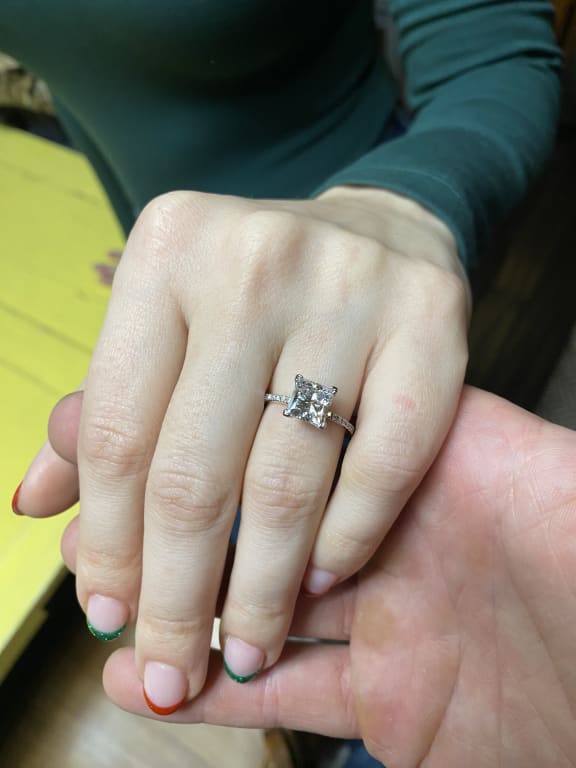 Oval diamond ring on hand