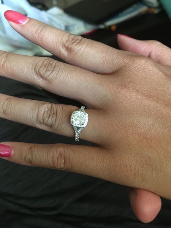 Oval diamond ring on hand