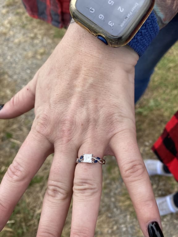 Oval diamond ring on hand