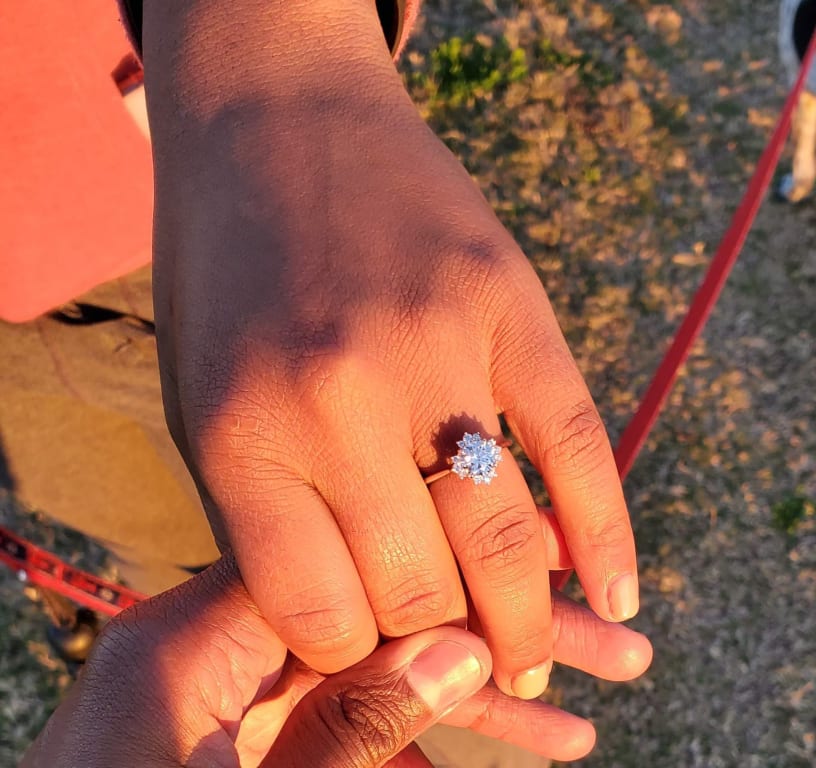 Oval diamond ring on hand