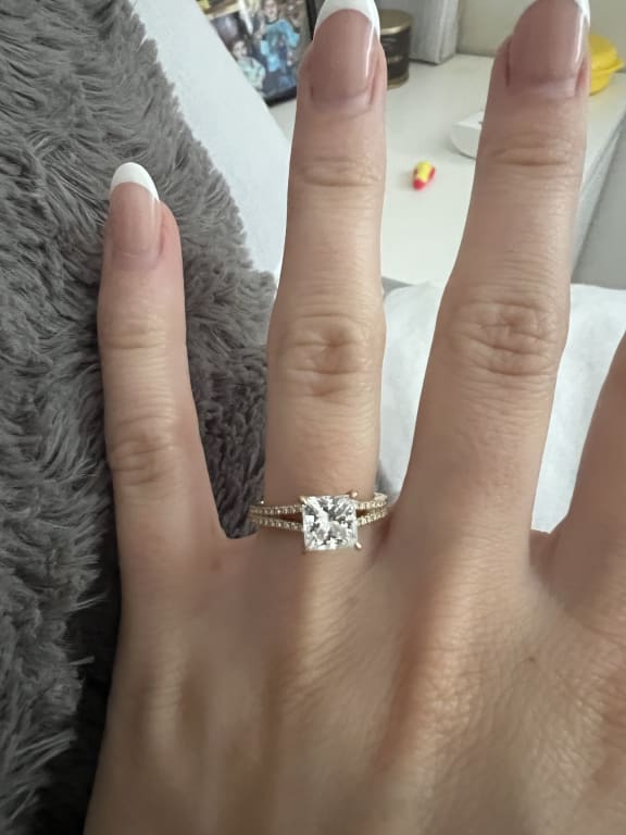 Oval diamond ring on hand