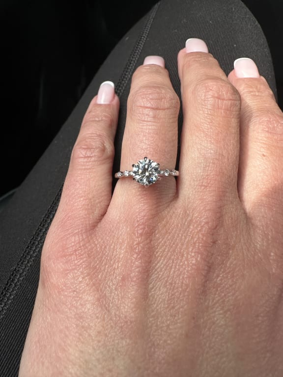 Oval diamond ring on hand