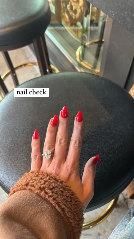 Oval diamond ring on hand