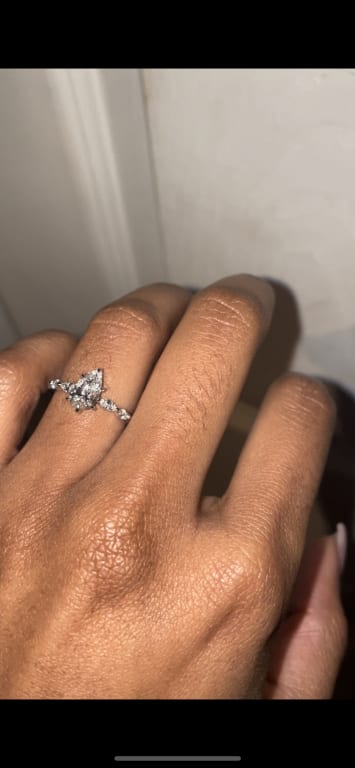 Oval diamond ring on hand