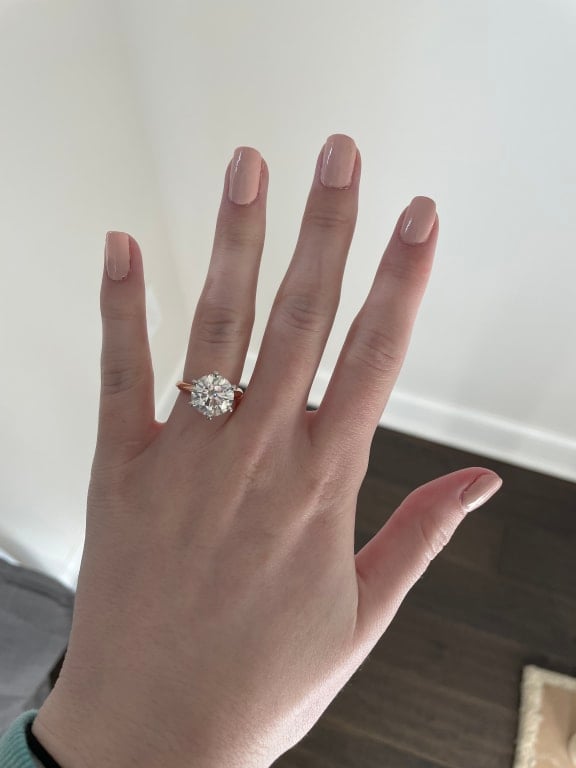 Oval diamond ring on hand