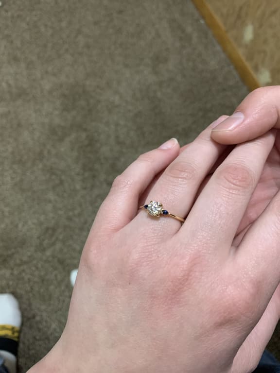 Oval diamond ring on hand