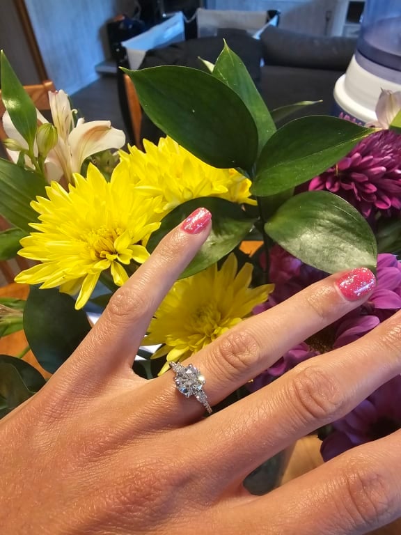 Oval diamond ring on hand