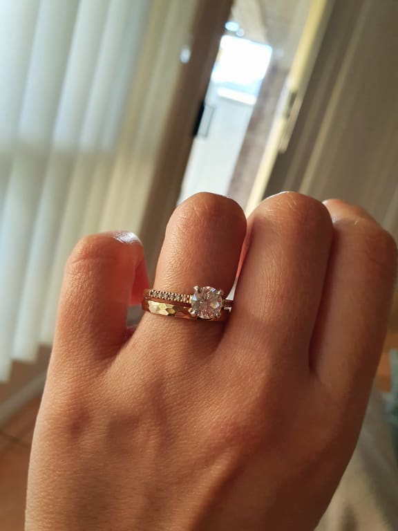 Oval diamond ring on hand