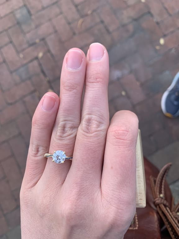 Oval diamond ring on hand
