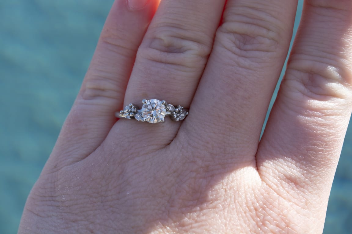 Oval diamond ring on hand