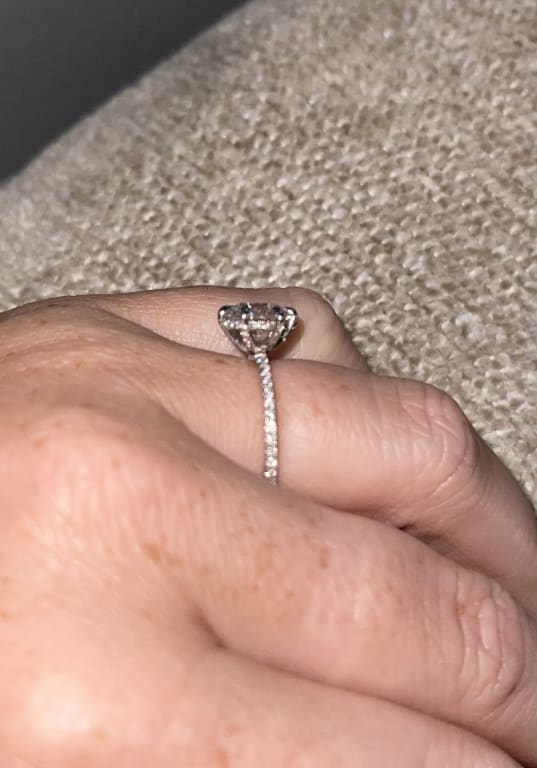 Oval diamond ring on hand