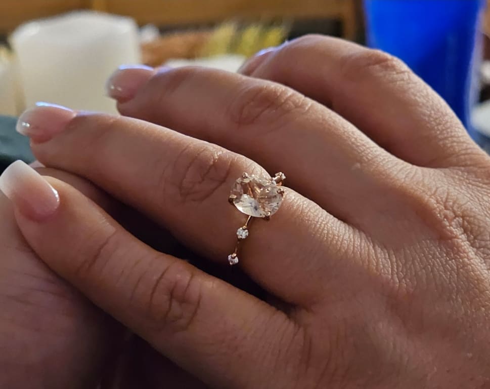 Oval diamond ring on hand
