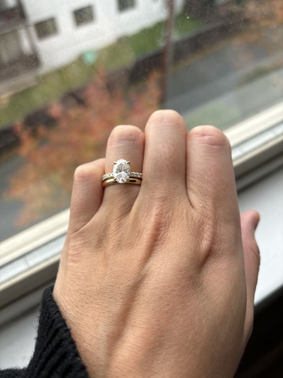 Oval diamond ring on hand